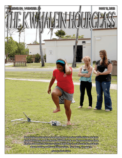 Dori DeBrum launches a handmade paper rocket while fellow students